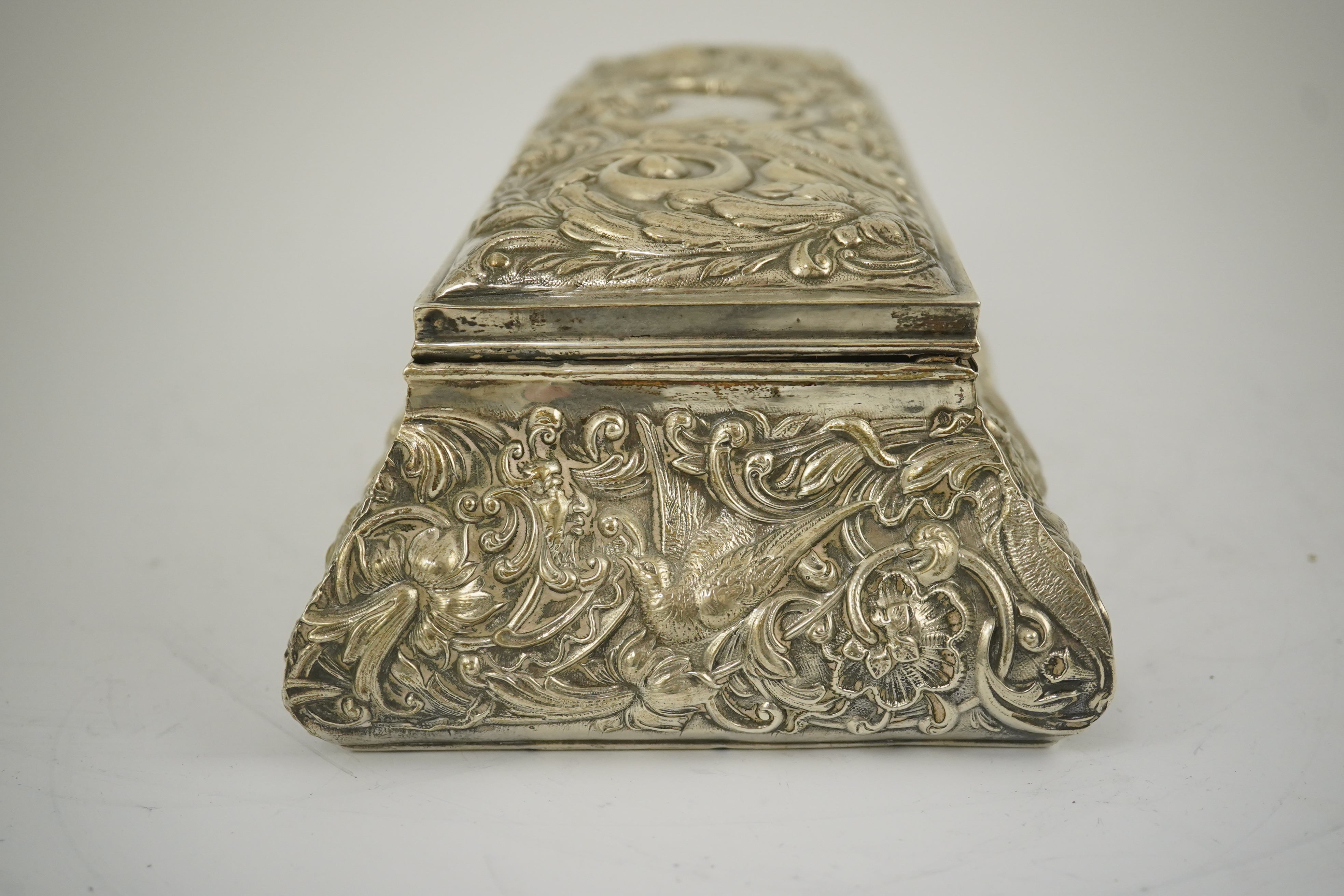 An Edwardian repousse silver mounted jewellery casket, by William Comyns